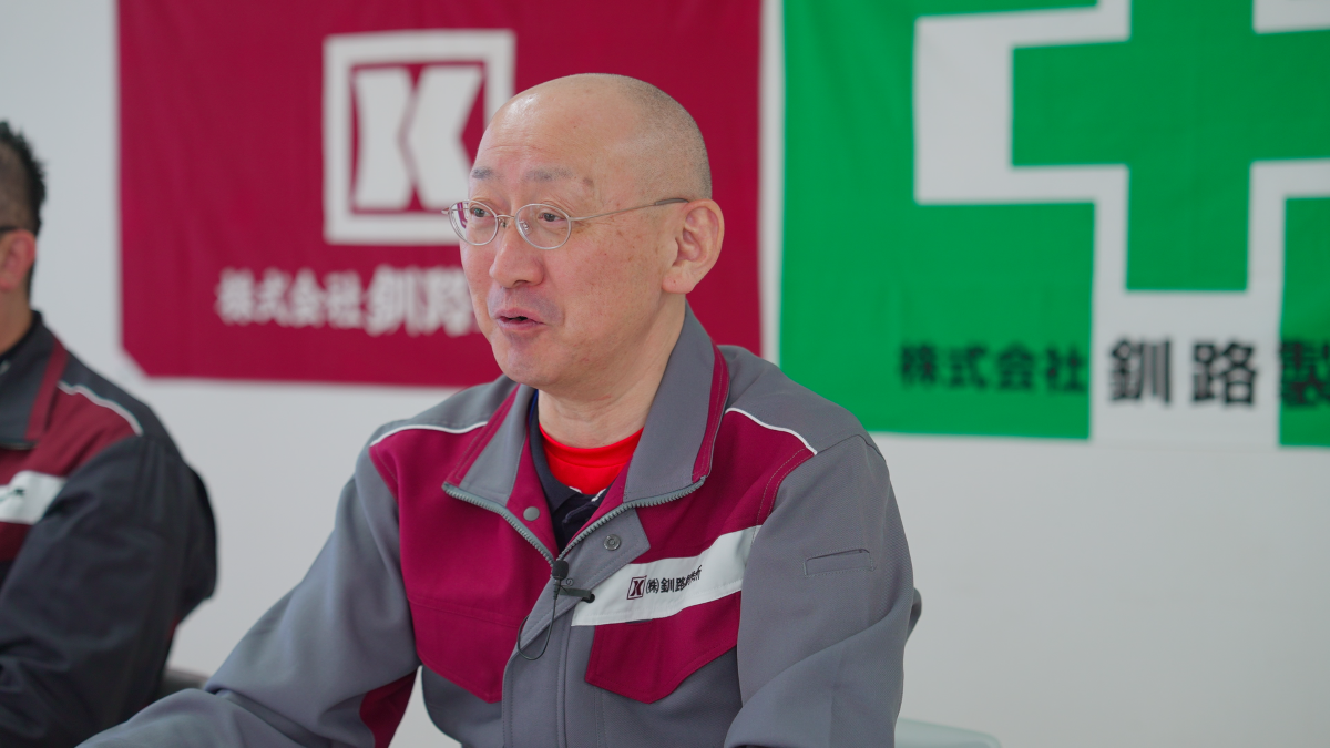 新システムを導入後の課題とその解決について話す山崎氏